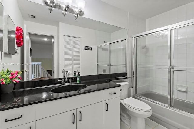 11613 NW 11th Pl, Coral Springs, FL 33071 - full bath featuring vanity, toilet, tile patterned floors, enclosed tub / shower combo, and visible vents