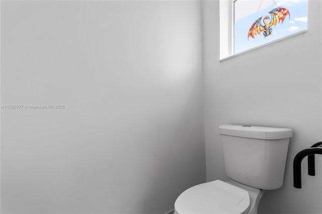 11613 NW 11th Pl, Coral Springs, FL 33071 - bathroom featuring baseboards and toilet