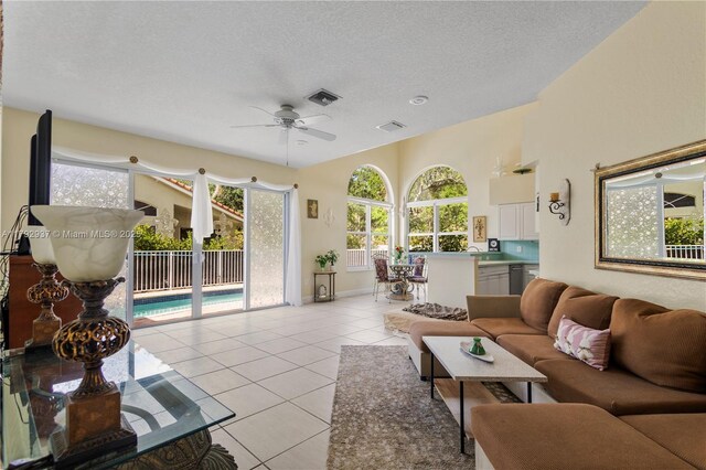 11613 NW 11th Pl, Coral Springs, FL 33071 - living room featuring a ceiling fan, visible vents, plenty of natural light, and light tile patterned flooring