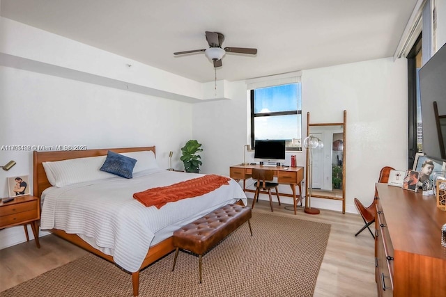 bedroom with light wood finished floors