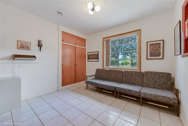 sitting room with light tile patterned floors and visible vents