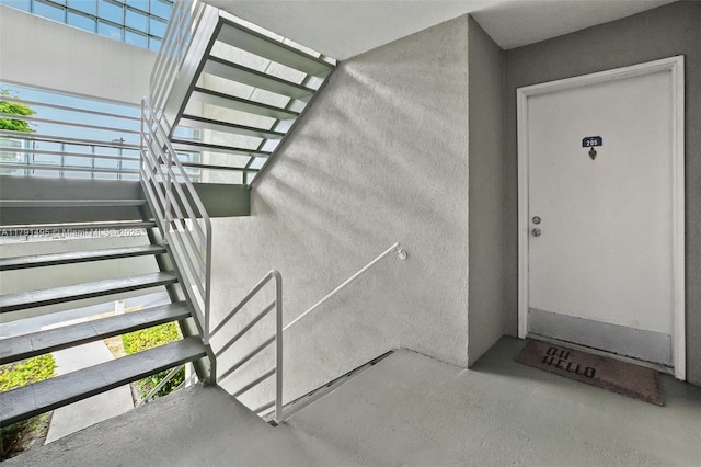 view of exterior entry with stucco siding