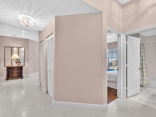102 Gables Blvd, Weston, FL 33326 - hall with baseboards and a textured ceiling