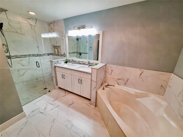 bathroom with marble finish floor, a marble finish shower, a bath, and vanity