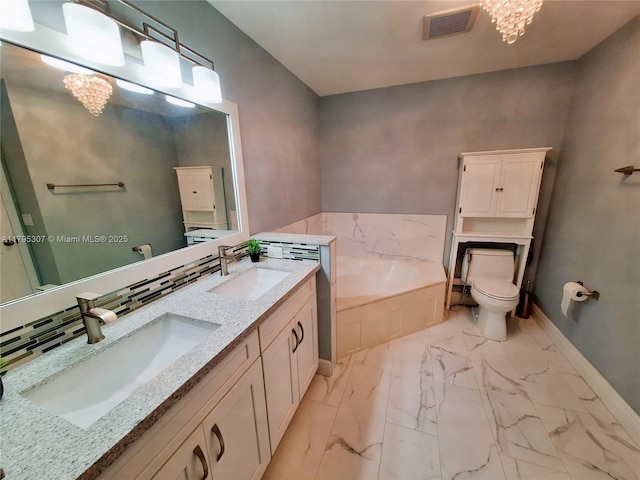 bathroom featuring baseboards, visible vents, a sink, and marble finish floor