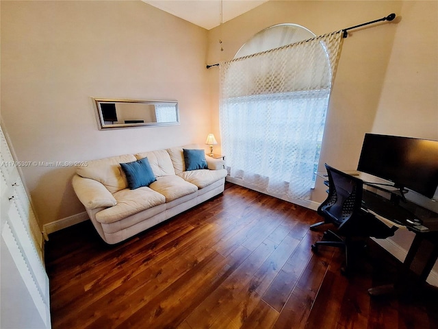 office featuring baseboards and hardwood / wood-style floors