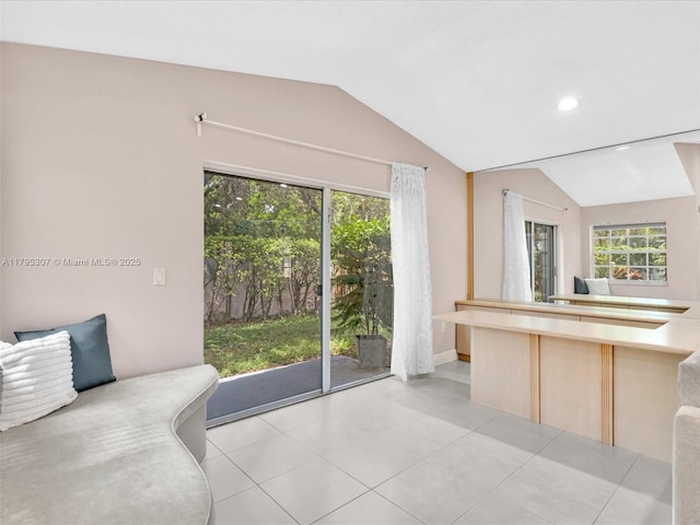 102 Gables Blvd, Weston, FL 33326 - kitchen featuring vaulted ceiling, open floor plan, healthy amount of natural light, light brown cabinetry, and light countertops