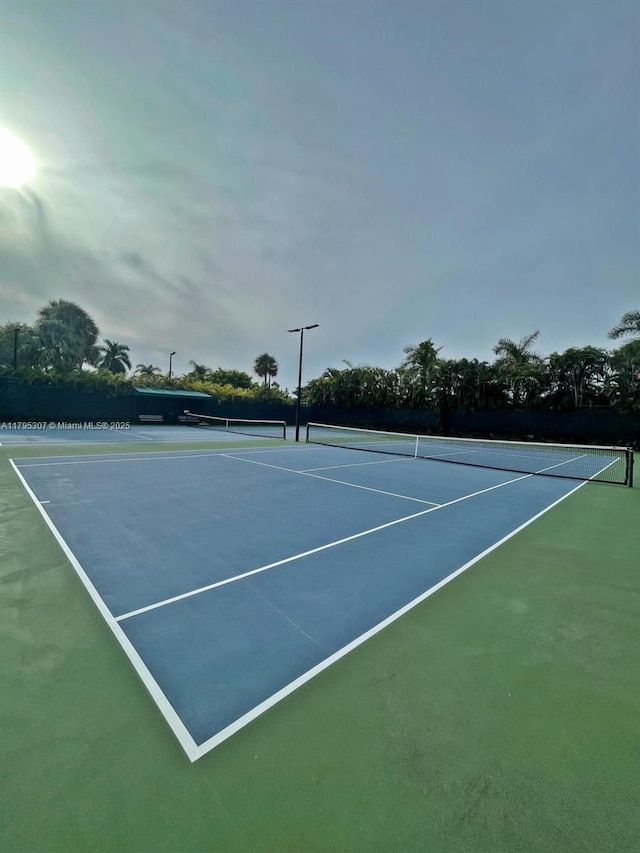 view of sport court with community basketball court and fence