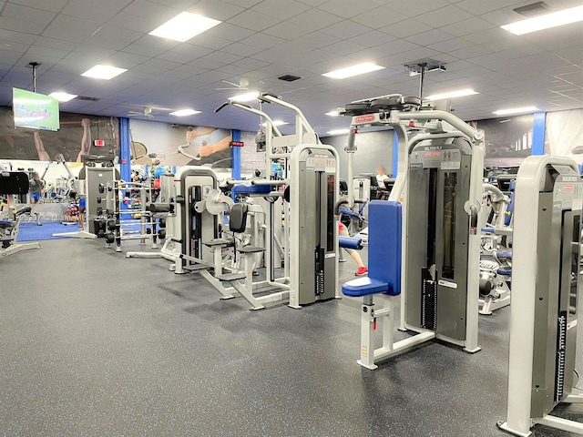 gym featuring a drop ceiling and visible vents