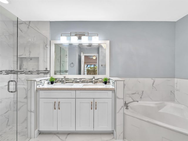 102 Gables Blvd, Weston, FL 33326 - bathroom featuring a garden tub, a marble finish shower, double vanity, marble finish floors, and ceiling fan