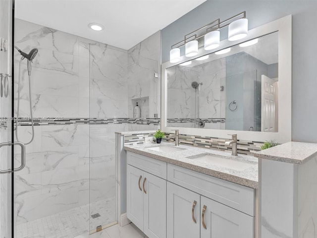 102 Gables Blvd, Weston, FL 33326 - full bathroom featuring a marble finish shower, double vanity, and marble finish flooring