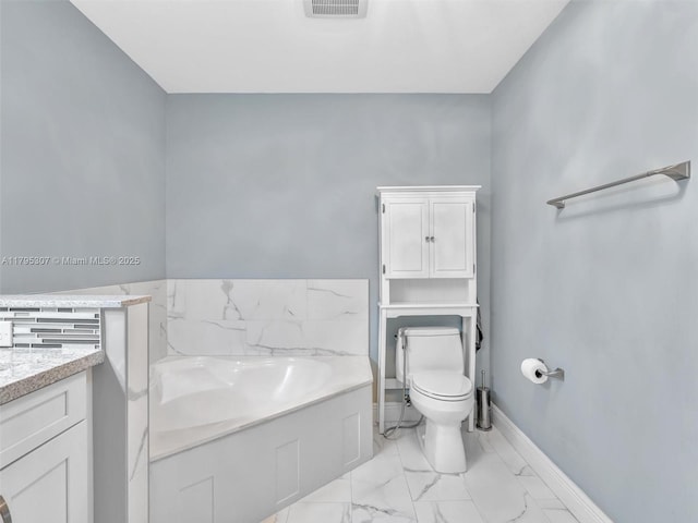 102 Gables Blvd, Weston, FL 33326 - full bath featuring marble finish flooring, a garden tub, toilet, vanity, and baseboards