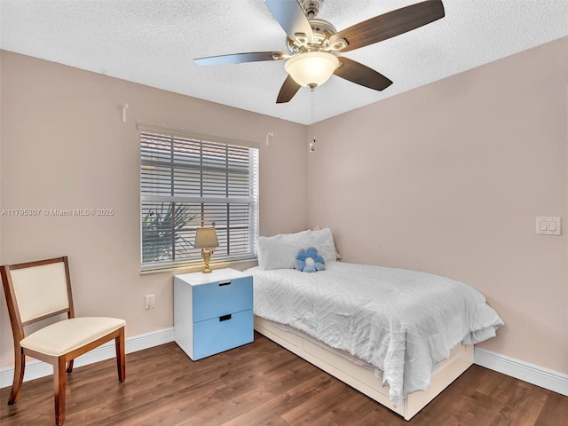 102 Gables Blvd, Weston, FL 33326 - bedroom with wood finished floors, a textured ceiling, and a ceiling fan