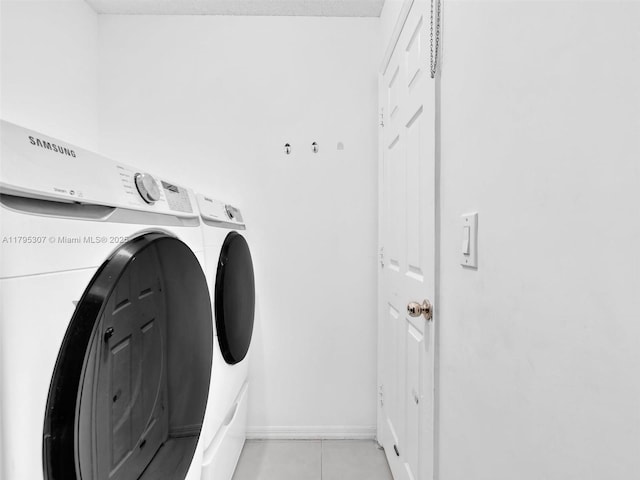 102 Gables Blvd, Weston, FL 33326 - laundry room with independent washer and dryer and light tile patterned floors