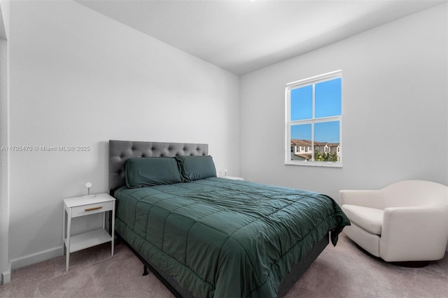 carpeted bedroom with baseboards