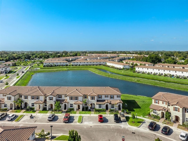 aerial view with a water view and a residential view