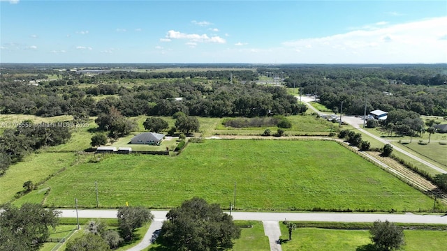birds eye view of property with a rural view