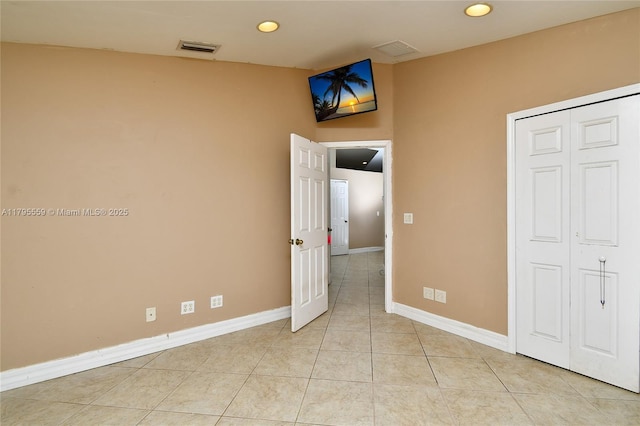 empty room with baseboards, recessed lighting, light tile patterned floors, and visible vents