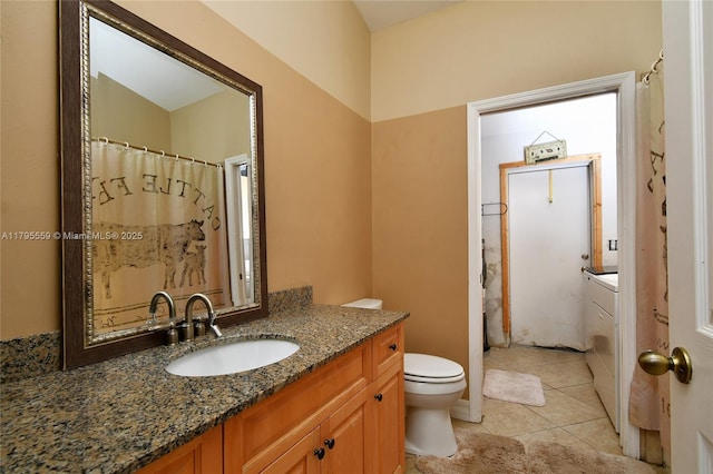 bathroom with vanity, toilet, and tile patterned flooring
