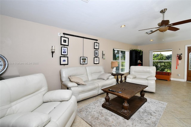 living area with baseboards, light tile patterned flooring, ceiling fan, and recessed lighting