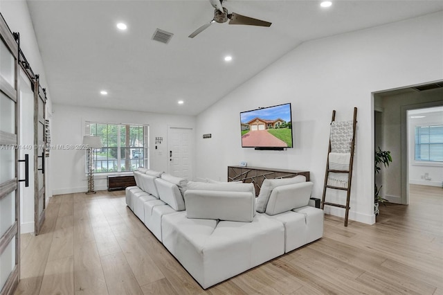 living room with light wood-style flooring, recessed lighting, a ceiling fan, a healthy amount of sunlight, and visible vents