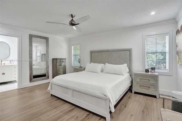 bedroom featuring connected bathroom, ornamental molding, light wood finished floors, and a ceiling fan