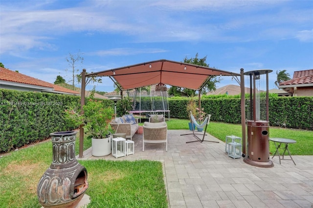 view of patio with a fenced backyard and a trampoline