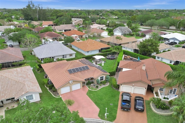 birds eye view of property with a residential view