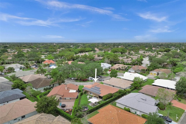 birds eye view of property with a residential view