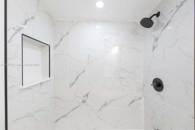full bathroom with a marble finish shower