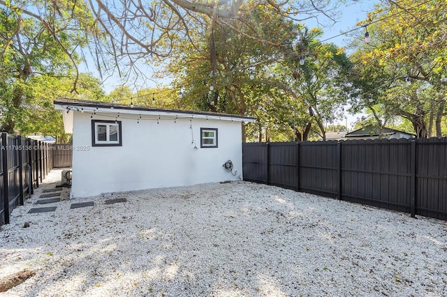 view of outbuilding with a fenced backyard