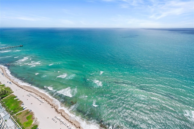 aerial view featuring a view of the beach and a water view