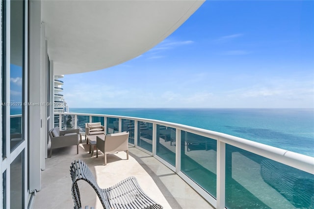 balcony featuring a water view