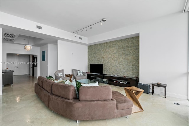 living area featuring rail lighting, visible vents, baseboards, and marble finish floor