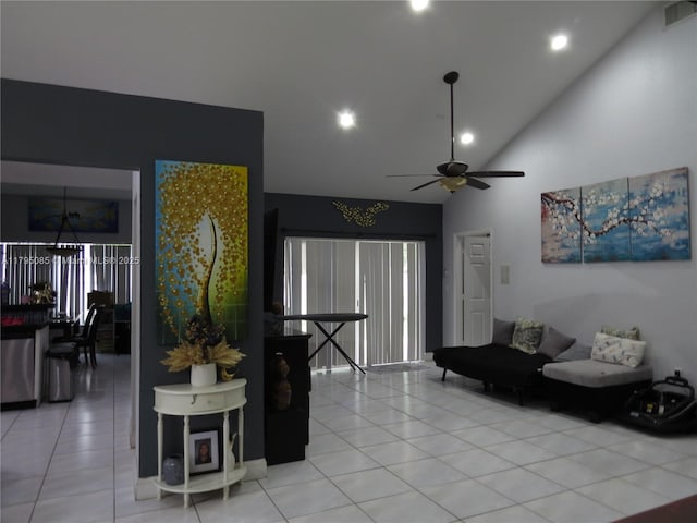 living room with a ceiling fan, visible vents, light tile patterned floors, high vaulted ceiling, and recessed lighting