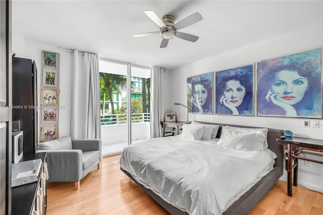 bedroom with light wood-style floors, access to outside, and a ceiling fan