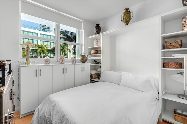 bedroom featuring light wood-style flooring