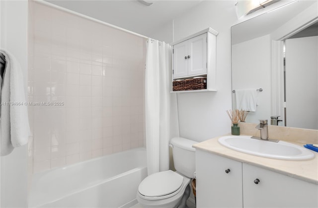 bathroom featuring toilet, shower / bath combo, and vanity