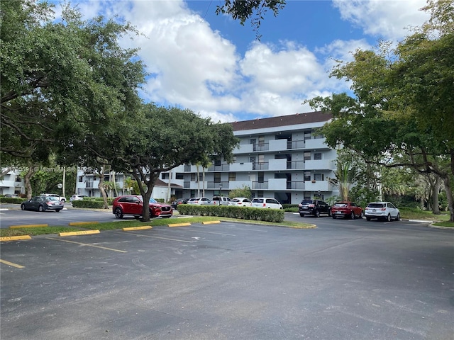 view of property with uncovered parking
