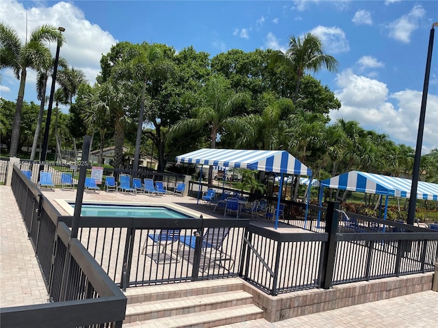 4133 S Carambola Cir S Unit G203, Coconut Creek, FL 33066 - community pool featuring a patio