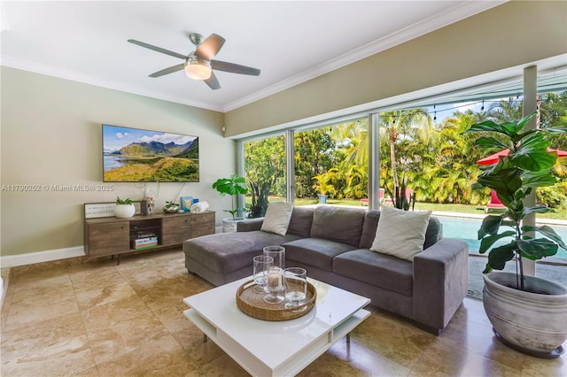 living room with baseboards, ornamental molding, and a ceiling fan
