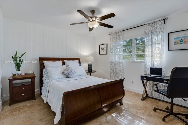 bedroom with ceiling fan and baseboards