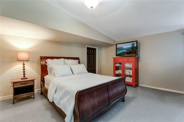 bedroom with baseboards, speckled floor, and vaulted ceiling