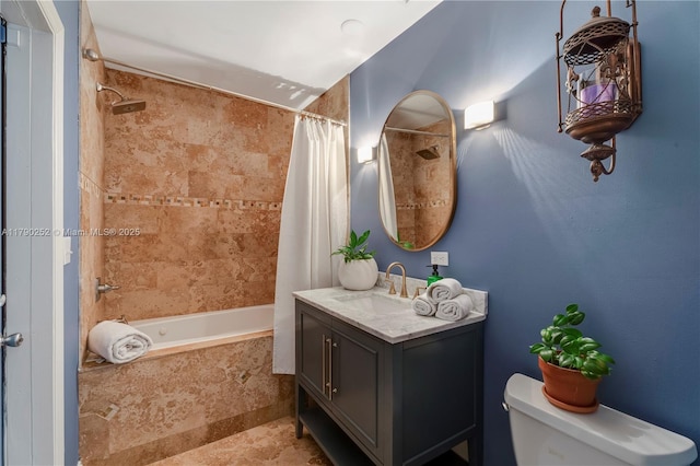 bathroom featuring vanity, shower / bath combination with curtain, and toilet