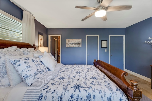 bedroom featuring baseboards and ceiling fan