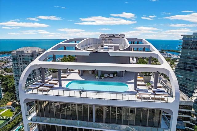 birds eye view of property with a water view