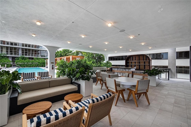 interior space with an outdoor living space and outdoor dining area
