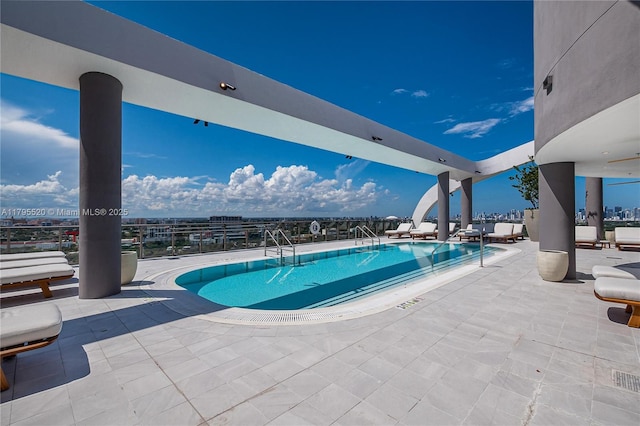 community pool with a patio area