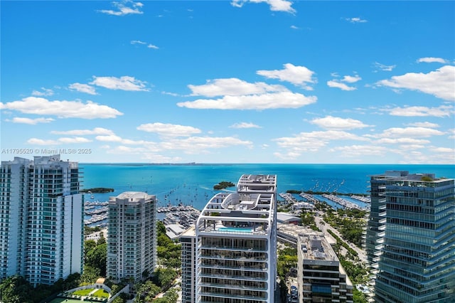aerial view featuring a water view and a city view