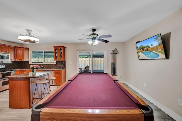 rec room with ceiling fan, billiards, and baseboards